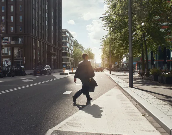 man walking on the street in business district